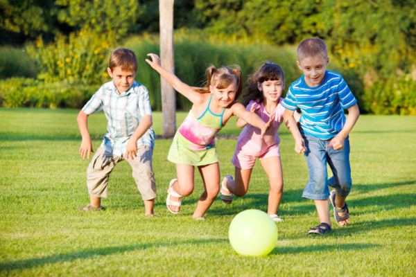 children enjoying a lawn by akron canton lawn care due to their fertilization and weed control treatments, richfield oh, copley oh, bath twp oh, fairlawn oh, lawn service