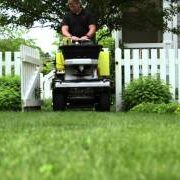 Applying fertilizer and spraying weed control, lawn care services provided by Akron Canton Lawn Care, grub control, pest control, copley ohio, north canton ohio, hudson oh